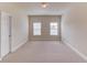 Light-filled bedroom offers neutral walls and plush carpeting at 764 Morganton Dr, Johns Creek, GA 30024