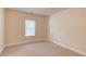 A well-lit bedroom with neutral walls and carpeted floor, showing a calm and inviting space at 764 Morganton Dr, Johns Creek, GA 30024