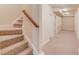 Finished basement hallway with stairs and neutral carpet at 764 Morganton Dr, Johns Creek, GA 30024