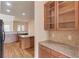 Stylish kitchen with wood floors, granite counters, and stainless-steel appliances, offering a modern, sleek design at 764 Morganton Dr, Johns Creek, GA 30024