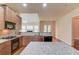 Well-equipped kitchen featuring granite countertops and modern appliances, ready for cooking and entertaining at 764 Morganton Dr, Johns Creek, GA 30024