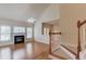 Inviting living room with a fireplace, hardwood floors, and an abundance of natural light, great for relaxing at 764 Morganton Dr, Johns Creek, GA 30024