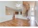 Open-concept living area with hardwood floors, staircase, and access to the kitchen at 764 Morganton Dr, Johns Creek, GA 30024