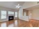 Cozy living room with hardwood floors, fireplace, and access to adjacent rooms at 764 Morganton Dr, Johns Creek, GA 30024