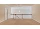 Bright loft features neutral walls, carpet, and an elegant light fixture at 764 Morganton Dr, Johns Creek, GA 30024
