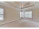 Spacious main bedroom featuring tray ceilings, neutral colors, and large windows for plenty of natural light at 764 Morganton Dr, Johns Creek, GA 30024