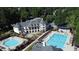 Aerial view featuring the community clubhouse and pool with a lane for swimming at 100 Pine Mist Cir, Alpharetta, GA 30022