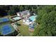 Aerial view showcasing the community clubhouse, pools, tennis courts, and playground at 100 Pine Mist Cir, Alpharetta, GA 30022