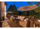 A full outdoor seating area with wicker furniture and dual umbrellas for shaded comfort at 100 Pine Mist Cir, Alpharetta, GA 30022