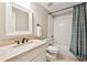 Bathroom featuring tub and shower combo with stylish shower curtain and large vanity mirror at 100 Pine Mist Cir, Alpharetta, GA 30022