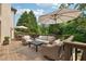 Spacious outdoor deck with comfortable seating and shade umbrellas; perfect for relaxing and entertaining at 100 Pine Mist Cir, Alpharetta, GA 30022