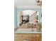 Dining room showcases a rustic wooden table with views into the living area and staircase at 100 Pine Mist Cir, Alpharetta, GA 30022