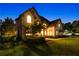 An executive home featuring an impressive roof line and meticulous landscaping at 100 Pine Mist Cir, Alpharetta, GA 30022