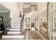 Bright, inviting foyer with hardwood floors and staircase at 100 Pine Mist Cir, Alpharetta, GA 30022