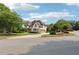 Attractive two-story home with a well-maintained lawn and long driveway at 100 Pine Mist Cir, Alpharetta, GA 30022