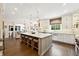 Open kitchen featuring an island with seating and stainless steel appliances, great for gatherings at 100 Pine Mist Cir, Alpharetta, GA 30022