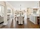 Open-concept kitchen and dining area with a chandelier and modern decor at 100 Pine Mist Cir, Alpharetta, GA 30022