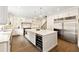 Gourmet kitchen with a large island, stainless steel appliances, and ample storage space at 100 Pine Mist Cir, Alpharetta, GA 30022