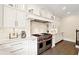 Well-equipped kitchen boasting a professional-grade stove and ample cabinet space at 100 Pine Mist Cir, Alpharetta, GA 30022