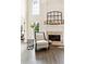 Bright and airy living room featuring a marble fireplace, and lots of natural light at 100 Pine Mist Cir, Alpharetta, GA 30022