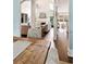Open-concept living room showcases a fireplace and seamless flow into dining area at 100 Pine Mist Cir, Alpharetta, GA 30022
