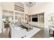 Stunning living room with a TV, high ceilings, and seamless flow to kitchen/dining areas at 100 Pine Mist Cir, Alpharetta, GA 30022