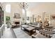 Beautiful living room with high ceilings, a cozy fireplace, and modern decor at 100 Pine Mist Cir, Alpharetta, GA 30022