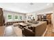 Basement living room featuring barn doors, large sectional and windows overlooking the backyard at 100 Pine Mist Cir, Alpharetta, GA 30022