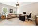 Home office featuring large sectional sofa, modern desk and guitar at 100 Pine Mist Cir, Alpharetta, GA 30022