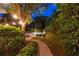 Professionally landscaped backyard provides an oasis with a serene pool and lush scenery at 100 Pine Mist Cir, Alpharetta, GA 30022