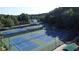 Overhead view showing the community tennis courts with new lighting and well-maintained turf at 100 Pine Mist Cir, Alpharetta, GA 30022