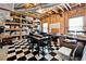 Spacious unfinished basement featuring black and white tile, storage shelving, and natural light at 100 Pine Mist Cir, Alpharetta, GA 30022