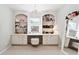 Home dressing room with built-in shelves, vanity with light-up mirror and plush stool at 100 Pine Mist Cir, Alpharetta, GA 30022