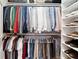 Large walk-in closet with clothing and shoe storage racks at 100 Pine Mist Cir, Alpharetta, GA 30022
