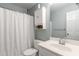 Neutral bathroom with a single sink vanity, standard toilet, and shower with curtain at 1019 Legacy Walk, Woodstock, GA 30189