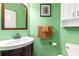 Green bathroom with a vanity and accent decor at 1019 Legacy Walk, Woodstock, GA 30189
