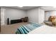 Spacious basement bedroom features carpet flooring, neutral walls, closet, and a workspace at 1019 Legacy Walk, Woodstock, GA 30189