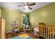 Bright bedroom with green walls and playful decor perfect for a  at 1019 Legacy Walk, Woodstock, GA 30189