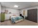 Basement bedroom with gray walls, large armoire, carpet floors, natural light, and streamlined design at 1019 Legacy Walk, Woodstock, GA 30189