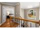 Bright foyer with hardwood floors and a view to the main bedroom through the door at 1019 Legacy Walk, Woodstock, GA 30189