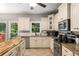 Updated kitchen featuring stone countertops, stainless steel appliances, and custom cabinets at 1019 Legacy Walk, Woodstock, GA 30189