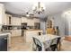 Well-lit kitchen and eat-in area featuring stainless steel appliances and custom cabinetry at 1019 Legacy Walk, Woodstock, GA 30189