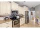 Updated kitchen with stainless steel appliances, granite countertops and custom cabinetry at 1019 Legacy Walk, Woodstock, GA 30189