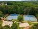 Community tennis courts offer a recreational amenity with playground and beautiful tree lined scenery at 1019 Legacy Walk, Woodstock, GA 30189