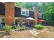 Backyard featuring a brick home, a patio, and lush greenery at 2505 Northlake Court Northeast, Atlanta, GA 30345