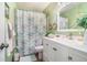 Bathroom featuring a white vanity, mirror, and a floral shower curtain at 2505 Northlake Court Northeast, Atlanta, GA 30345