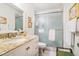 Clean bathroom featuring a glass-enclosed shower, granite countertop, and white cabinets at 2505 Northlake Court Northeast, Atlanta, GA 30345