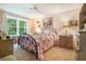 Inviting bedroom featuring a window with outdoor views, soft carpet, and a decorative bedspread at 2505 Northlake Court Northeast, Atlanta, GA 30345