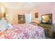 Cozy bedroom with floral bedding, wooden dresser, and natural lighting at 2505 Northlake Court Northeast, Atlanta, GA 30345