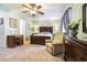 Comfortable bedroom with soft carpet, a ceiling fan, and a large bed with neutral bedding at 2505 Northlake Court Northeast, Atlanta, GA 30345